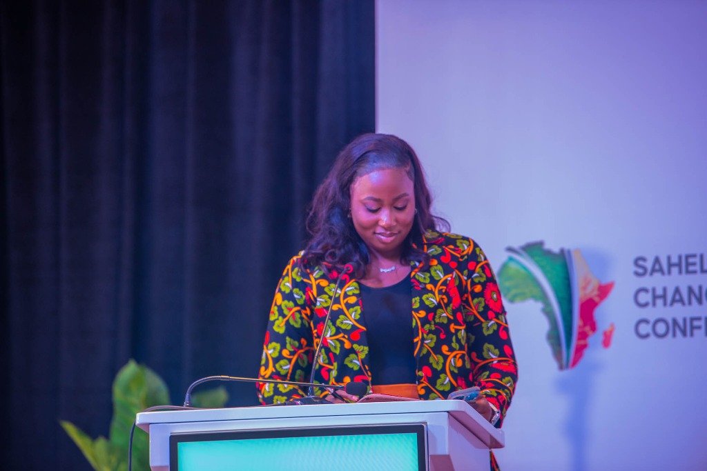 MacAnne Obize speaking at the Sahel Change Conference podium